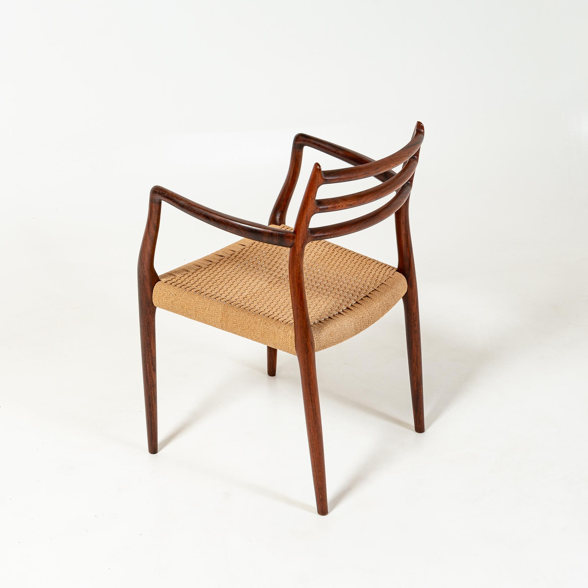 Single Møller 62 arm chair in Rosewood and Papercord