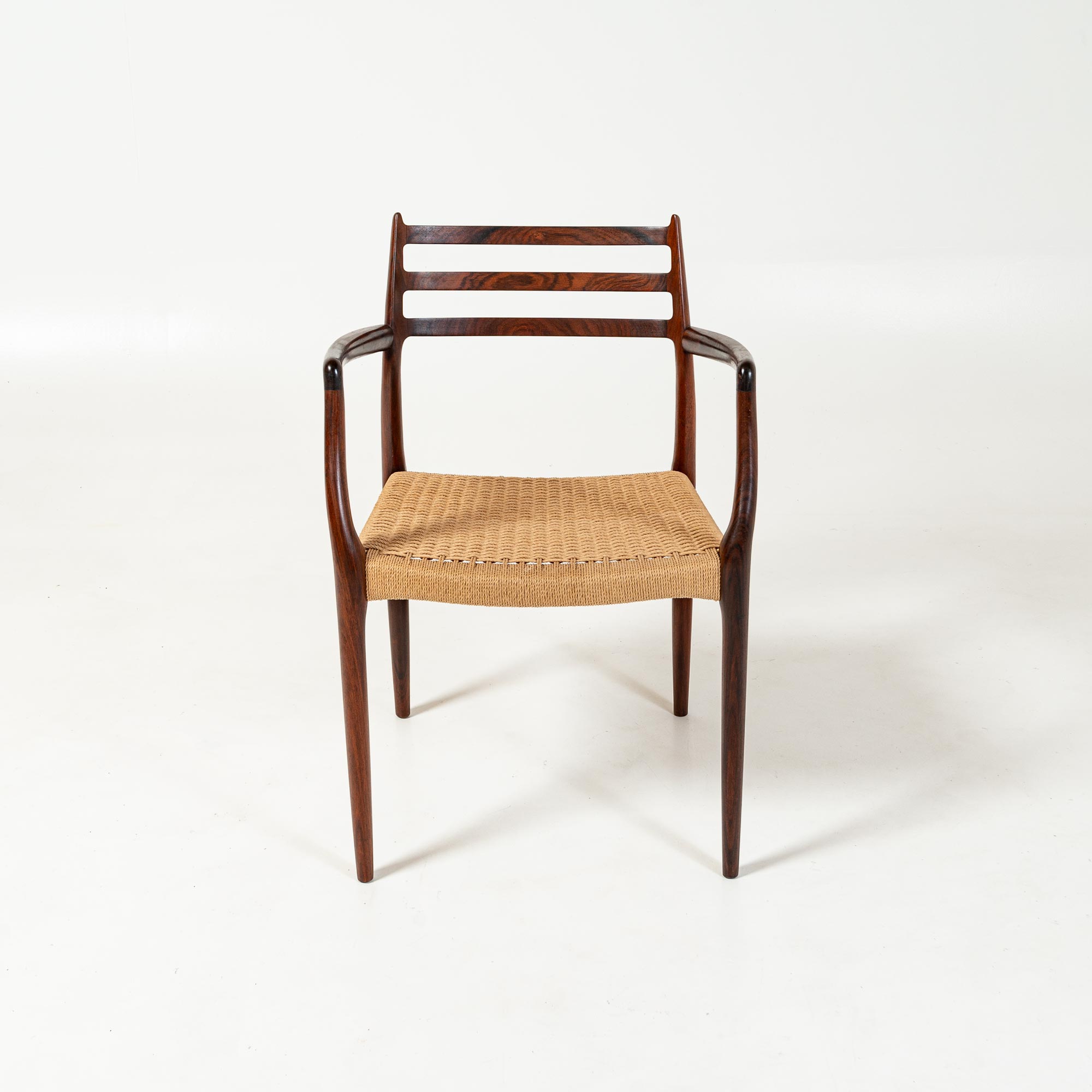 Single Møller 62 arm chair in Rosewood and Papercord