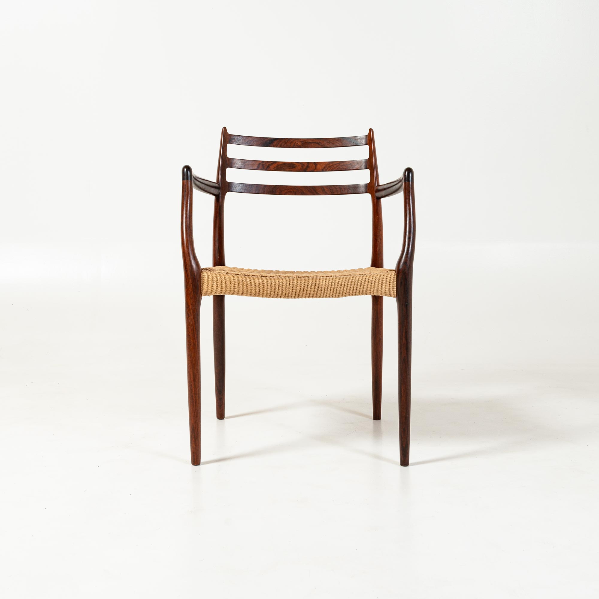 Single Møller 62 arm chair in Rosewood and Papercord