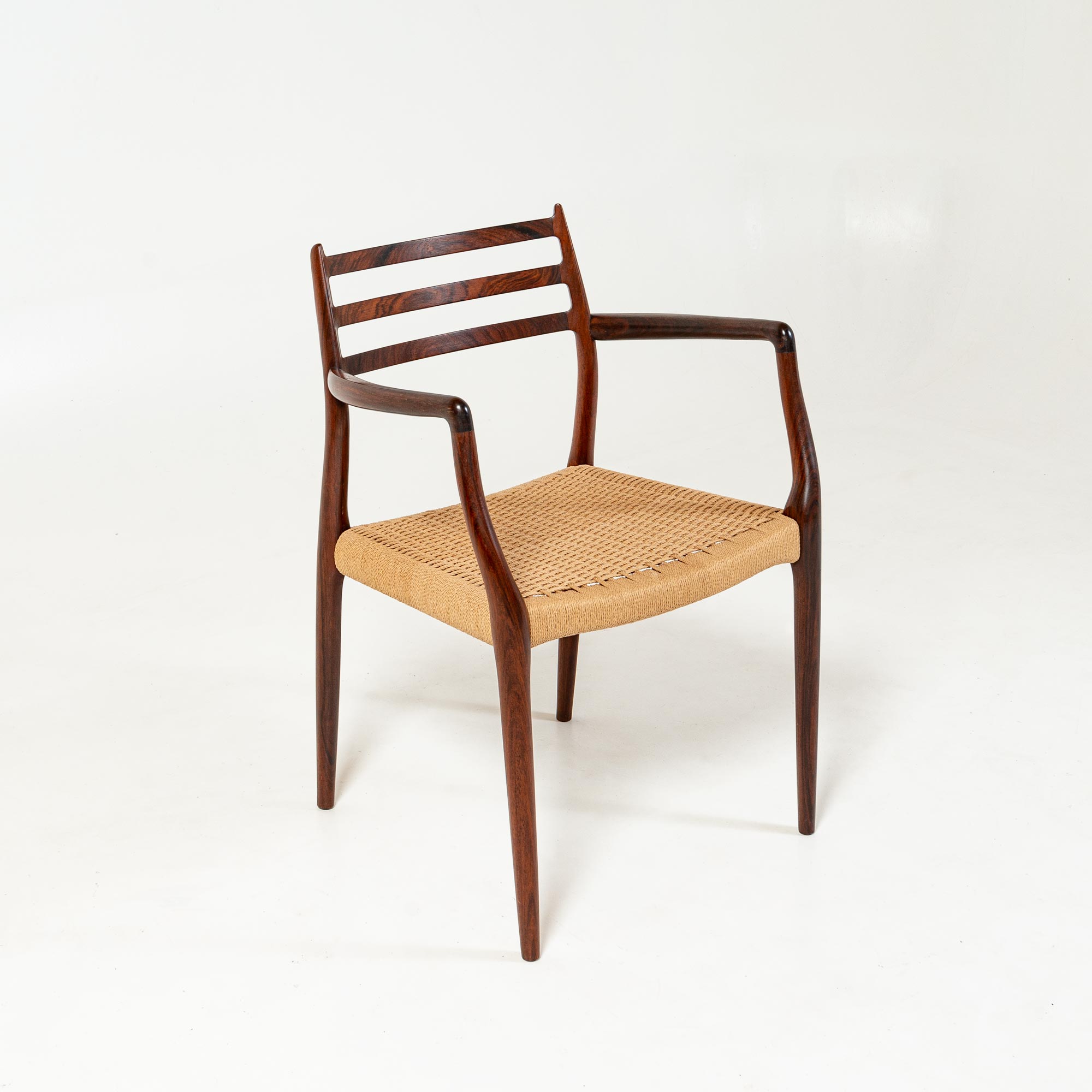 Single Møller 62 arm chair in Rosewood and Papercord