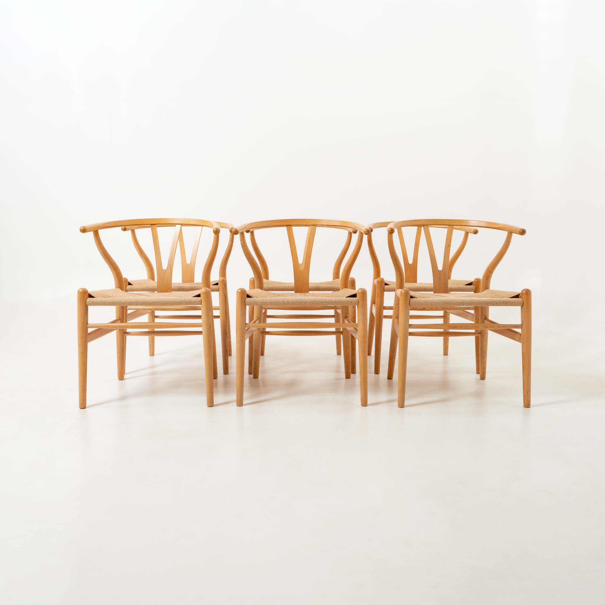 Set of six Hans Wegner for Carl Hansen & Son CH-24  Wishbone Chairs in Oak and Papercord