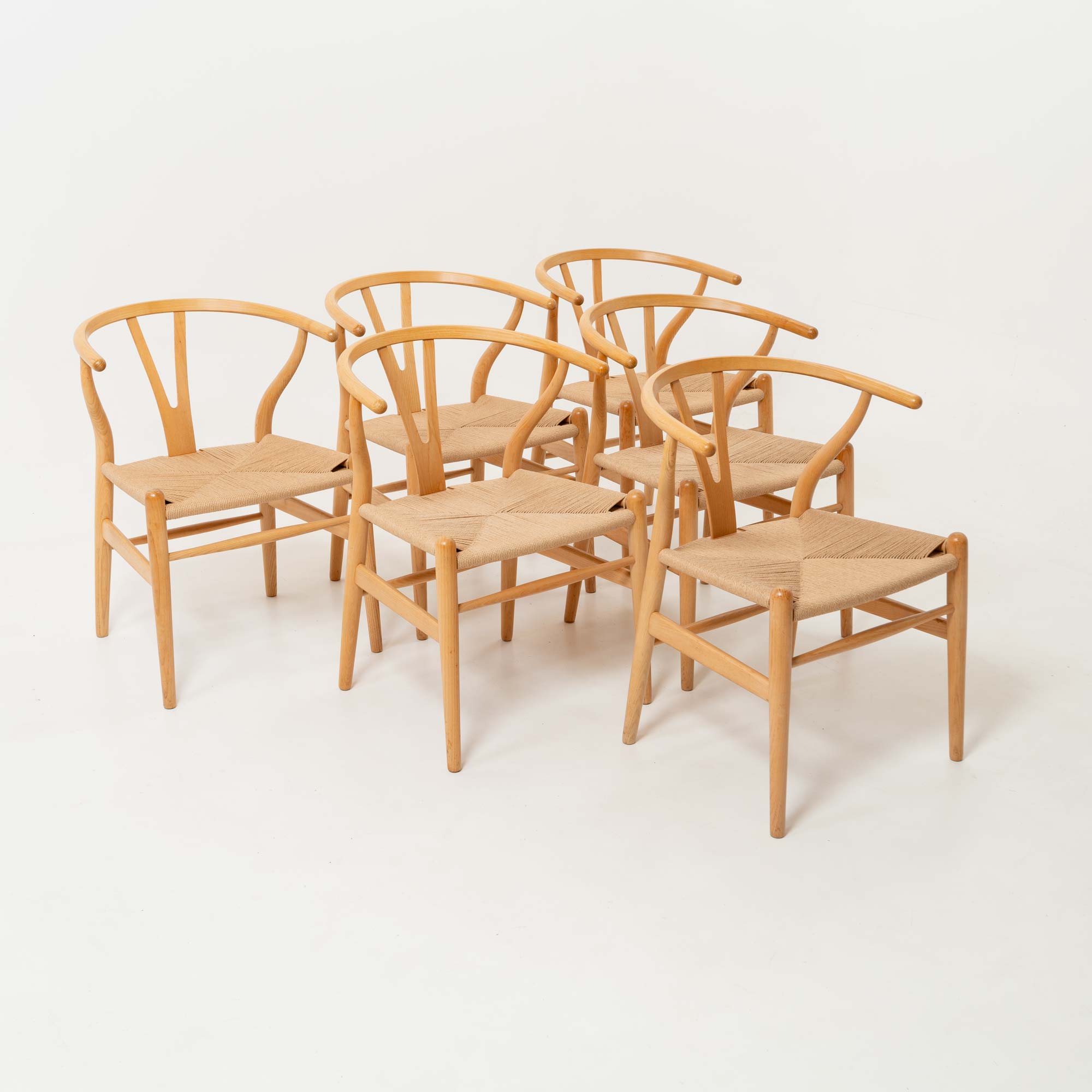 Set of six Hans Wegner for Carl Hansen & Son CH-24  Wishbone Chairs in Oak and Papercord