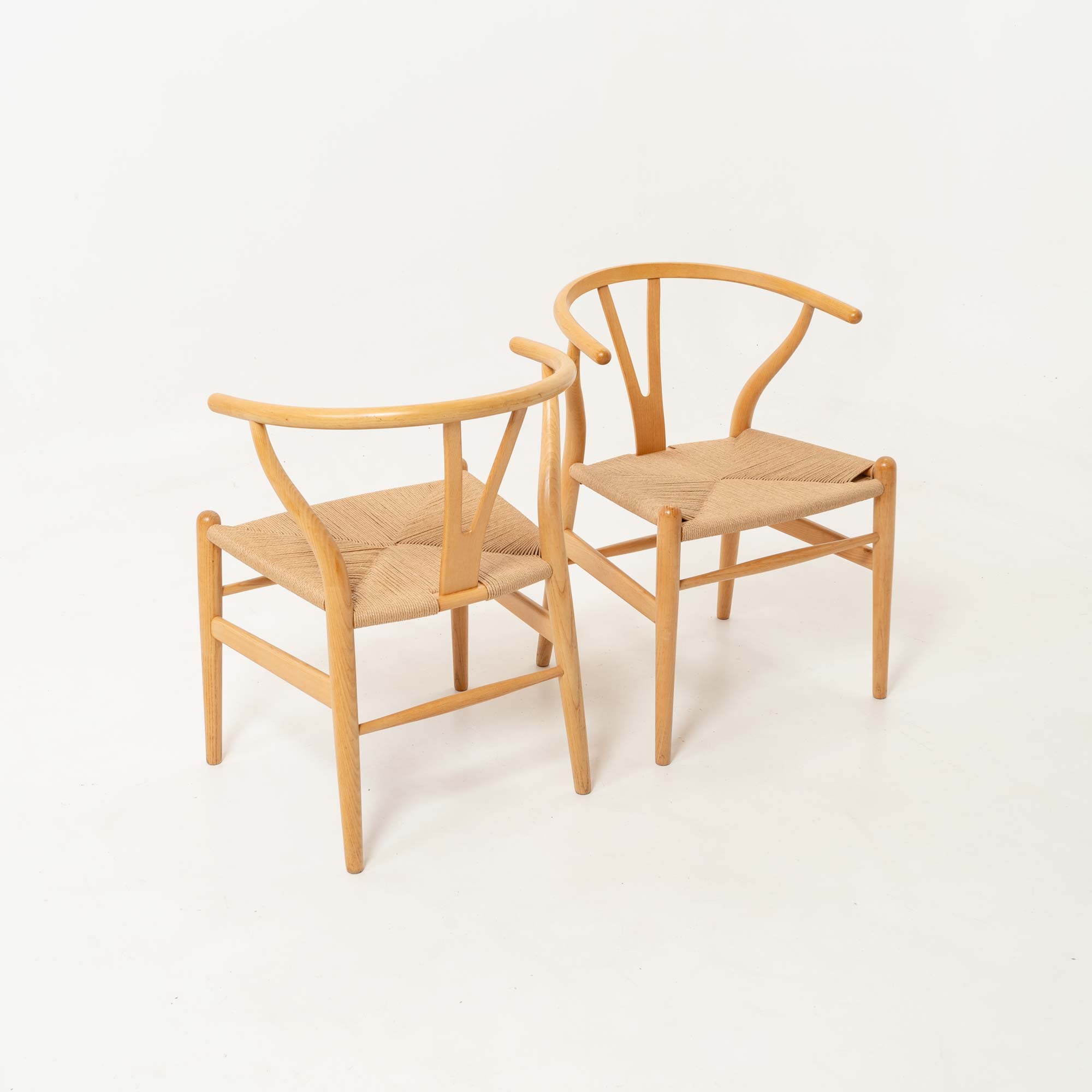 Set of six Hans Wegner for Carl Hansen & Son CH-24  Wishbone Chairs in Oak and Papercord