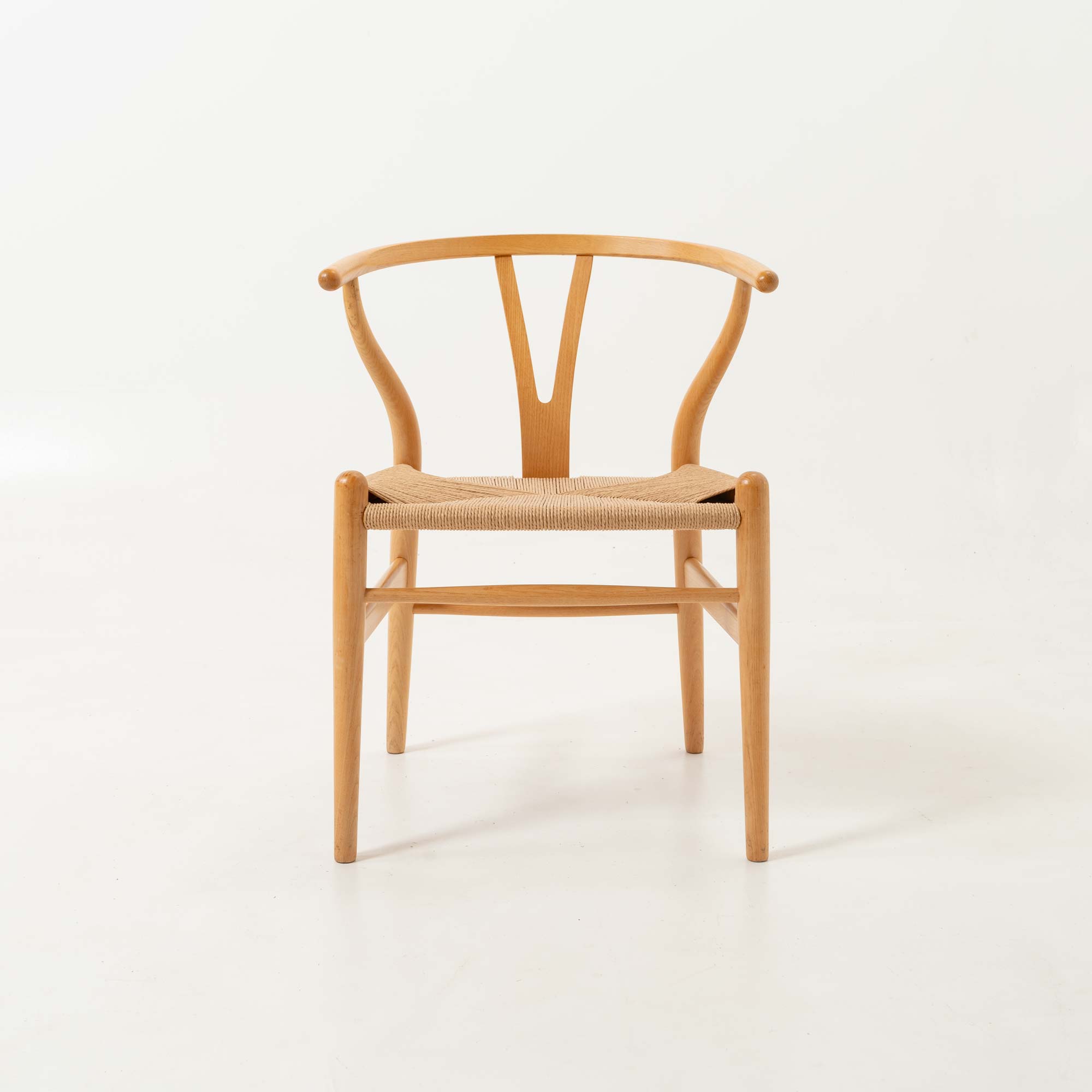 Set of six Hans Wegner for Carl Hansen & Son CH-24  Wishbone Chairs in Oak and Papercord