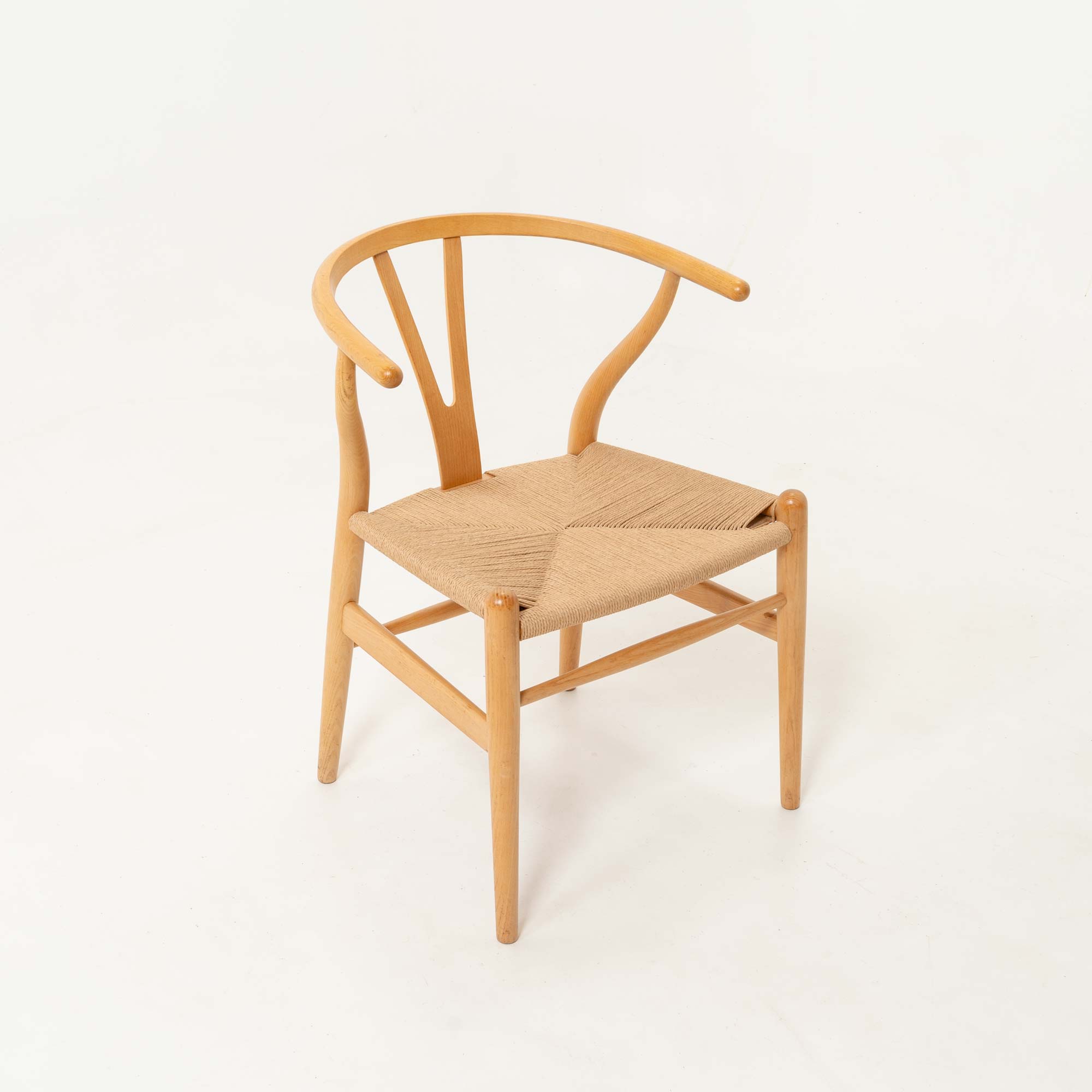 Set of six Hans Wegner for Carl Hansen & Son CH-24  Wishbone Chairs in Oak and Papercord